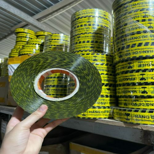 Băng dính logo dễ vỡ 1 kg/cây lõi giấy 5mm