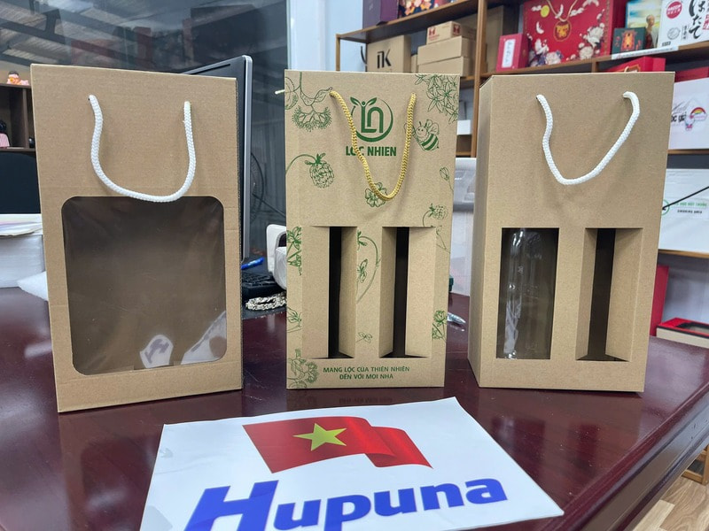 Hộp carton bóng kính quai xách in flexo đựng mật ong